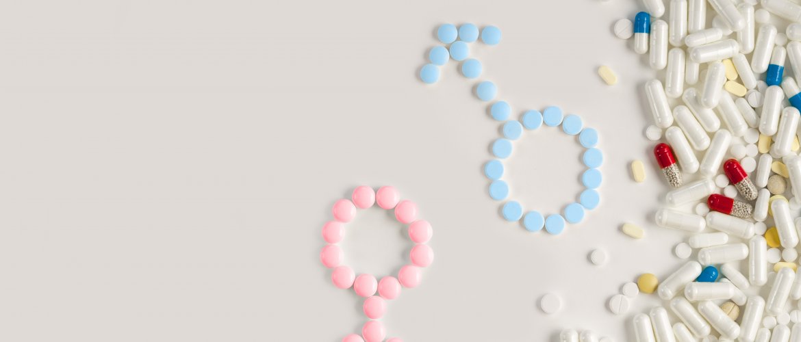 Diversos comprimidos formando os símbolos da mulher e do homem. Primeira consulta com médico da infertilidadeno o s